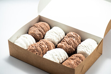 Box with a set of sweet marshmallows for a gift. On a white background in the studio.