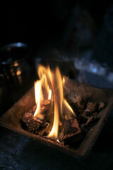 Fire Flame Cow dung Coal lit up with camphor during Worship of Diwali