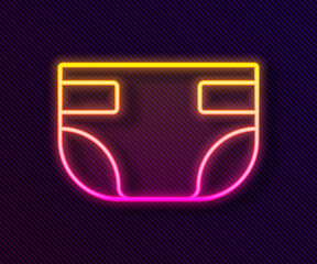 Glowing neon line Baby absorbent diaper icon isolated on black background. Vector.