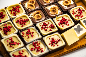 set of chocolate praline isolated on white background, selective focus