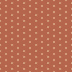 Polka dot seamless vector pattern in brown and beige colors.