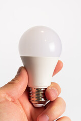 Eco lamp in hand. Led lamp, green technologies. Eco lamp. Energy efficiency concept.