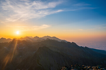 Obraz premium Scenic image of Fairytale mountains during sunrise. The sunrise over a mountain in park High Tatras. Slovakia, Europe. Wonderful Autumn landscape. Picturesque view of nature Amazing natural Background