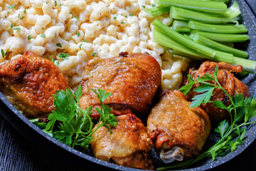 roast chicken thighs with pasta in a skillet