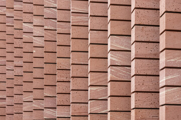 Fototapeta premium Abstract texture of stone wall with repeating elements