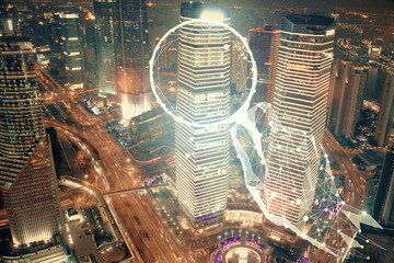 Double exposure of start up theme drawings over cityscape background. Concept of success.