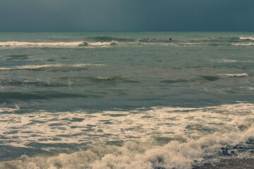 Incredible storm on the beach. Vacation landscape with rain. Gray day at the beach.