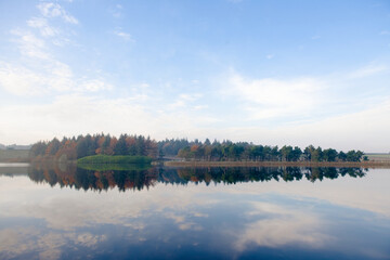 Stunning blue skies reflected in mirror like redmires reservoir water
