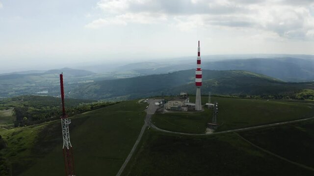 Big red and white Aerial on top of a mountain. Pic de Nore, sum of the black mountain, radar, parabol