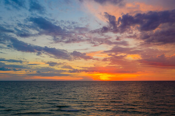 Seascape. The setting sun over the sea. Copy space. Shooting from a drone.