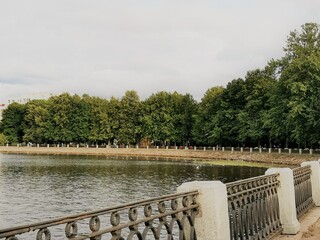 Fence of embankment of sea and trees in Vyborg, Russia