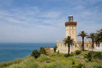 Fototapeta na wymiar View of the old lighthouse on the Atlantic Ocean coast on the Cape Spartel in northern Morocco.