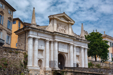 Fototapeta na wymiar View of the Porta San Giacomo gate in Bergamo. Its gate, leading through the Venetian walls to the upper city of Bergamo, was built in 1592 from pinkish-white marble.