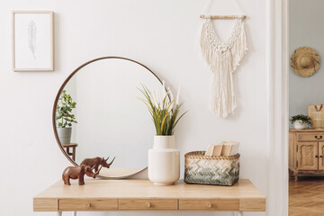 Sunny boho interiors of apartment with mirror, dressing table, furnitures, flowers, plants, rattan...