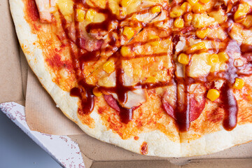 Tasty pizza in carton box. Copy space. Delivery concept.