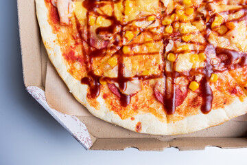 Tasty pizza in carton box. Copy space. Delivery concept.