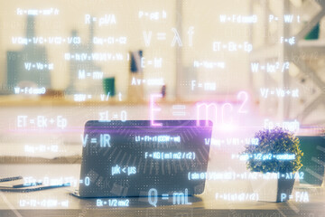 Desktop computer background and formula hologram writing. Double exposure. Education concept.