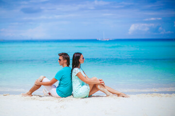 Young couple on white beach during summer vacation.