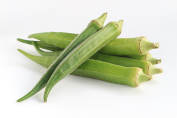 Fresh vegetable okra on white background.