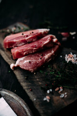 Raw pork steak on a wooden table