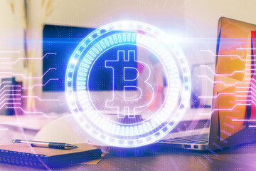 Multi exposure of blockchain and crypto economy theme hologram and table with computer background....