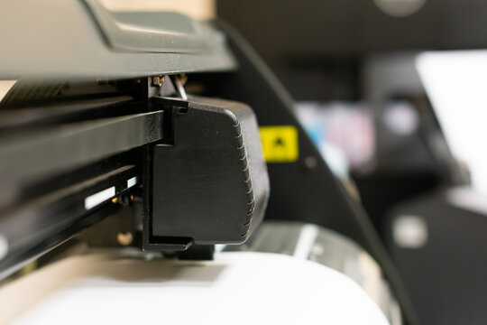 Cutting plotter close-up. The process of cutting a vinyl film. Vinyl cutting. Cutting machine stickers.
