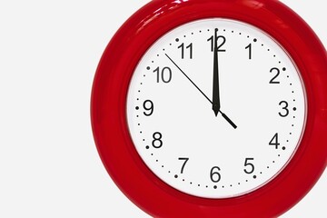 large of red color analog clock show 12 hours at midnight or noon close-up