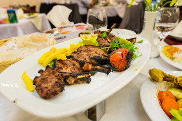 Iranian food Lamp Chop on a white plate in a restaurant in Tehran, Iran.