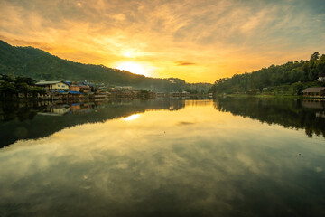 Beautiful of lake view in the morning sunrise, Ban Rak Thai village, landmark and popular for tourists attractions, Mae Hong Son province, Thailand. Travel concept