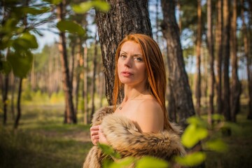 Redhead Scandinavian modern Viking woman, medieval atmosphere, attractive middle aged woman in furs