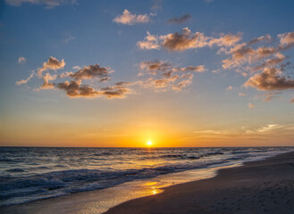 Naklejka na ściany i meble Sunset oiver the Gulf of Mexico from Sanibel Island Florida in the United States