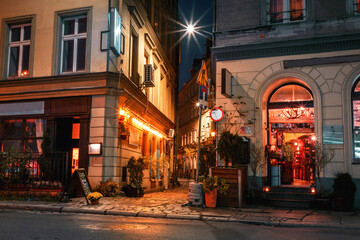 night street of the city of wroclaw with a cafe and a lane