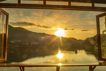 lake view at coffee shop in the morning sunrise, Ban Rak Thai village, landmark and popular for tourists attractions, Mae Hong Son province, Thailand. Travel concept
