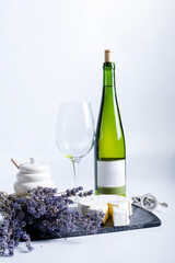 Wine bottle and two wine glasses. Wine bottle against a white background