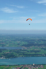 Paragliding over Forggensee lake in Bavaria, Germany
