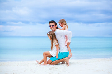 Fototapeta premium Happy beautiful family on a tropical beach vacation