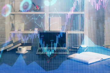 Financial graph colorful drawing and table with computer on background. Multi exposure. Concept of...