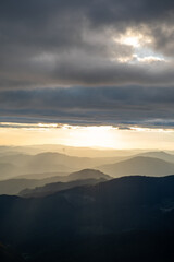 view of sunset above mountains peak