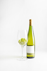 Wine bottle and two wine glasses. Wine bottle against a white background