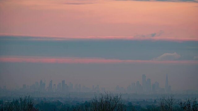 Time lapse of distant London skyline on the horizon during twilight. Taken from Epsom in Surrey
