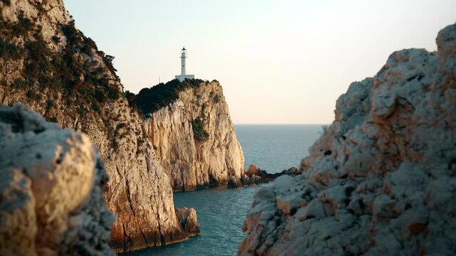 Beautiful lighthouse surrounded by steep cliffs at the most southen part of Lefkada island called Cape Lefkas