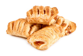 Fresh puff on the white background. Cookies from puff pastry with colored jam. Homemade baking. Dessert for tea. Croissant