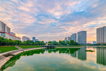 Fototapeta premium Cityscape of Hanoi skyline at Thanh Xuan park during sunset time in Hanoi city, Vietnam