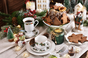 Christmas table setting in white red green colors in rustic style