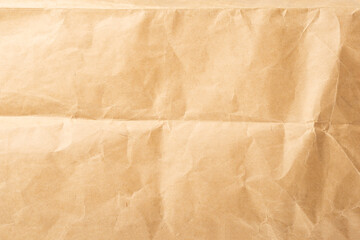 Craft paper. Crumpled brown cardboard paper texture. Old Crumpled recycled paper texture, color beige. Brown background