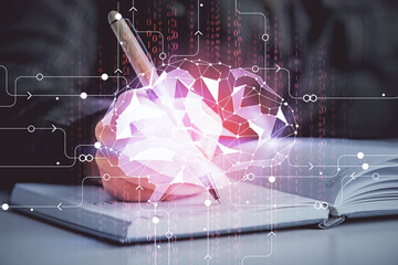 Multi exposure of woman's writing hand on background with brain hologram. Concept of brainstorming.