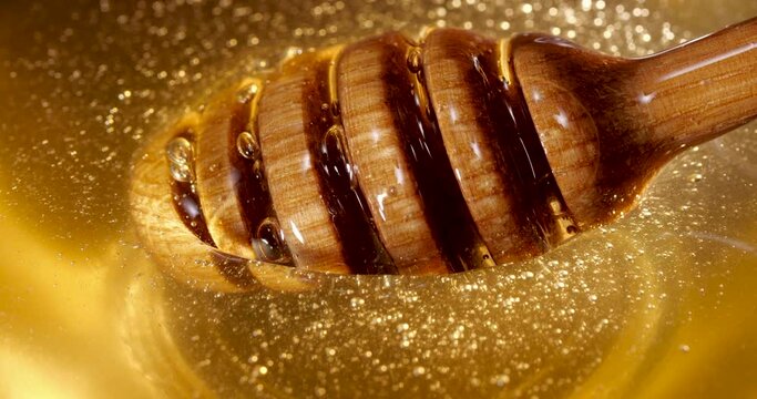 honey stick rotates in honey, healthy and wholesome dessert, natural product