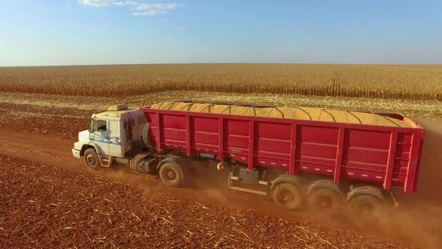 Aerial image of a truck transporting soybeans, a truck loaded with grain. Harvest being transported to the silo - Agriculture