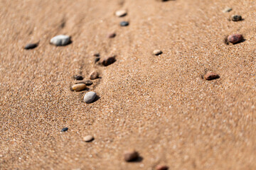 Fototapeta na wymiar Small pebbles on the beach