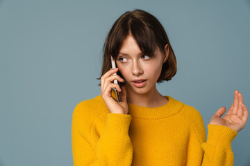 Portrait of a thoughtful woman talking on the phone
